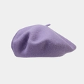 Detail view of the purple wool beret showing its thick texture and classic top loop - Purple