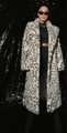 Detailed close-up of leopard print faux fox fur coat with black spots and soft texture - S / As Shown