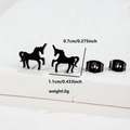 Macro shot showing dimensions 0.7x1.1cm of black unicorn stud earrings in stainless steel - Unicorn (078) / Black
