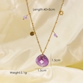 Halskette aus Titanstahl in Gold mit lila Tropfenkristall und Sternanhängern - Amethyst