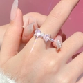 Elegant silver bow ring with pink heart zircon stones and sparkling diamond accents - Silver Pink Zirconia Bow Ring (G-422) / Pink