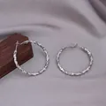 Silver geometric textured large hoop earrings on gray silk background with modern clasp - E-031---Platinum 30mm