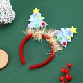 Detailed view of blue felt Christmas tree headbands with colorful pompoms and stars - Sky Blue