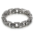 Bracciale vintage in acciaio al titanio argento con incisioni floreali e design audace - Stile Inciso con Erba Tang Retrò (KB14466-D)