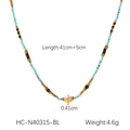 Close-up of turquoise and black beaded necklace with gold pendant on white background - Turquoise (HC-N40315-BL)