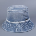 Close-up of washed denim bucket hat with metallic brand tag and stitched brim detail - M (56-58cm) / Light Blue