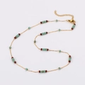 Detailed view of gold chain necklace featuring colorful beaded turquoise and red accents - Necklace