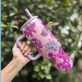 Pink stainless steel tumbler with purple floral patterns and a convenient carry handle - 40oz / Flowers Everywhere