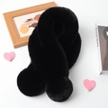 Detail of soft black faux rabbit fur scarf with plush pom-poms and elegant texture - Black