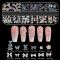 Detail of 12-grid nail art kit with aurora bows, pearls, and resin bears on black base - Cream Bow (12TZ-10)