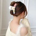 White plush hair claw clip with colorful cartoon characters on a female model - Plush Colored Beads(FJ063)