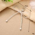 Detailed macro view of handmade pearl bow charm with dimensions 10x12cm and lobster clasp - Crystal Bow Pendant (Clip)
