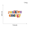 Detailed view of positive energy embroidered patch with 7.6cm width and 4.1cm height - Style 3 Positive Energy Letter Patch