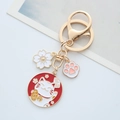 Japanese Maneki Neko keychain set with gold metal cherry blossom and cat paw charms - Lucky Cat Keychain - Bell