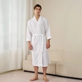 White waffle weave men's bathrobe with kimono collar and waist belt in home setting - White (Men's)