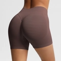 Detailed back view of seamless high-waisted fitness shorts with peach lift contouring - Coffee