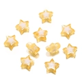 Close-up of yellow and white acrylic star beads with holes for DIY craft jewelry making - Yellow