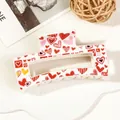 Detail of white rectangular hair claw clip with colorful heart pattern on a decorative tray - 8.5cm Heart Print - Style I White Base