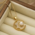 Golden sun-shaped necklace with pearl and zircon pendant in a wooden jewelry box - Sun and Crescent Moon Pendant / Gold