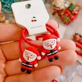 Pair of red Christmas hair ties with 3D resin Santa Claus figures on a white card - 3D Santa Claus