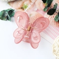 Elegant large butterfly hair claw clip in translucent pink resin with golden spring - Jelly Peach