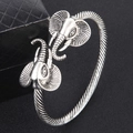 Vintage silver open cuff bracelet for men featuring carved elephant heads and twisted band - Elephant Head / Antique Silver