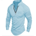 Detail of light blue polo shirt featuring textured shoulder pleats and black metal zipper - Sky Blue