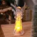 Primer plano de un ángel de acrílico brillante con luces LED cálidas para Navidad - Estilo Trompeta