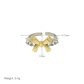 Macro shot of two-tone bow ring featuring gold plating and sparkling zircon stones - Adjustable Open / Style G Bowknot (Two-Tone)