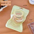 Set of spiral hair ties with floral and glitter designs in a green zip pouch - Green Series Set (D4-512#) / 6 Pcs/Bag