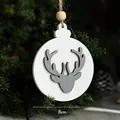 8cm wooden Christmas reindeer ornament hanging on a pine tree branch with a rustic string - Round Deer Head Pendant