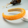 Detail of bright orange crystal beaded headband with thick sponge padding and non-slip lining - Orange
