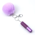 Portachiavi con pompon viola in pelliccia sintetica e ciondolo a forma di boccetta di profumo - Viola