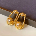 Macro view of gold hoop earrings with textured frame and smooth metallic bead detail - 12# Silver Earring Post - Gold - Real Gold Plating