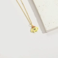 Golden necklace with a yellow cartoon dog pendant wearing a brown beret on white background - Yellow Dog