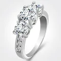 Elegant silver-tone ring featuring three round brilliant-cut blue cubic zirconia stones - US 8 / Three-Stone Silver Style
