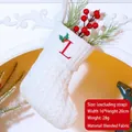 White cable knit Christmas stocking with red embroidered letter L and holly detail - Letter L / White