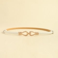 Detailed close-up of white leather belt featuring a golden interlocking twisted buckle - White