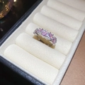 Detailed view of silver ring featuring four round pink gemstones with pave-set zircons - Round Style / Silver-Pink