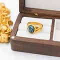 Vintage 18k gold plated titanium ring with oval blue agate stone on a velvet display - Blue Agate