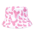 Pink cow print cotton bucket hat with reversible casual design on white background - One Size / Red