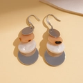 Detail of bohemian acrylic earrings with layered geometric orange and silver disks - Earring Hooks - Silver