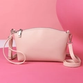 Elegant pink lychee textured leather crescent shoulder bag with silver zipper detail - Pink