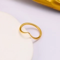 Close-up of minimalist wave-shaped golden stainless steel ring with a matte finish texture - Ck928-gold-us6