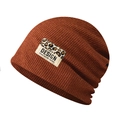 Detailed close-up of the caramel knit beanie texture and the leopard print fabric patch - Adjustable / Caramel With Leopard Patch