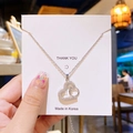 Collier en acier titane avec pendentif cœur serti de zircons brillants en fini argent - Bague Coeur en Argent
