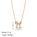 Collana a fiocco dorata con cristalli, pendente 11x12mm, catena regolabile da 40+5cm - Oro