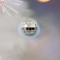 Macro shot of silver disco ball ornament with reflective mosaic mirror glass facets - 2cm Sphere