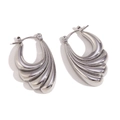 Elegant silver-toned stainless steel J-shaped earrings with textured shell ripples - Cast Wave Wings Hoop Earrings - Steel Silver
