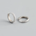Detailed close-up of S925 sterling silver hoop earrings with pavé set zircon stones - Outer Diameter 12mm / Silver